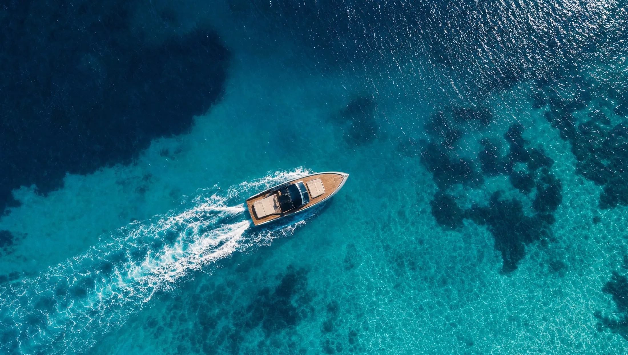 Aerial view of the boat carving a wake across the Red Sea